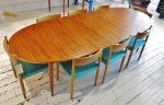 Beautifully restored double extension table by Parker circa 1960
Teak
Fully extended : 2700 mm in length
Can be reduced by one leaf or both.

Set of 8 Danish dining chairs in Oak with new aqua blue fabric seats
Fully restored condition